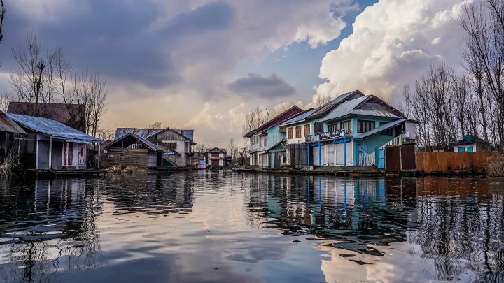 Image shows houses floating on flooded ground