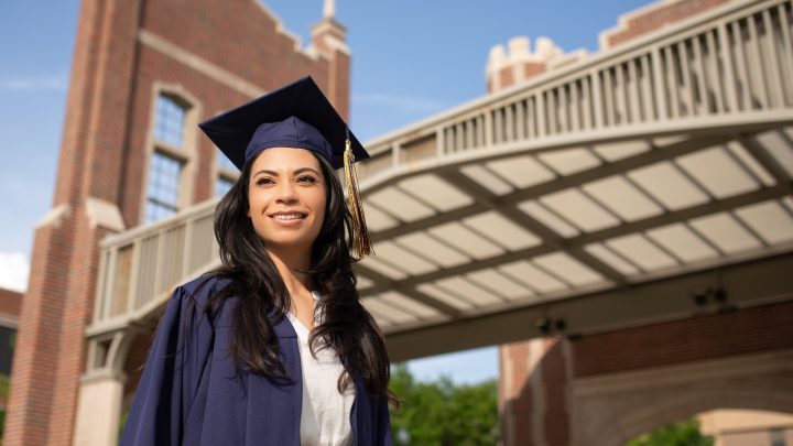 Stock photo image of woman wearing cap and gown